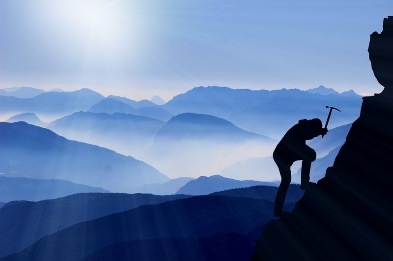 Mountaineer climbing a mountain